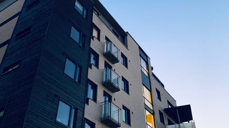 Modern apartment building exterior at dusk